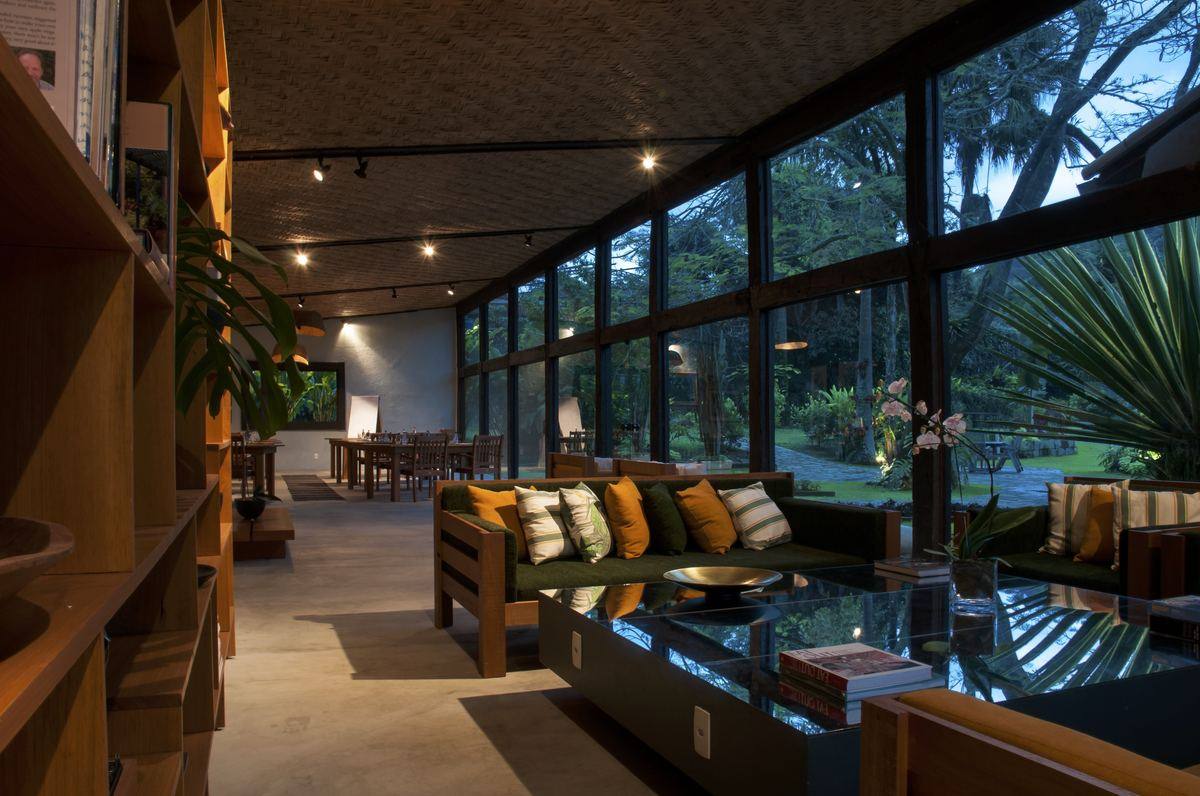 Reception Area — lounge with glass walls and garden view