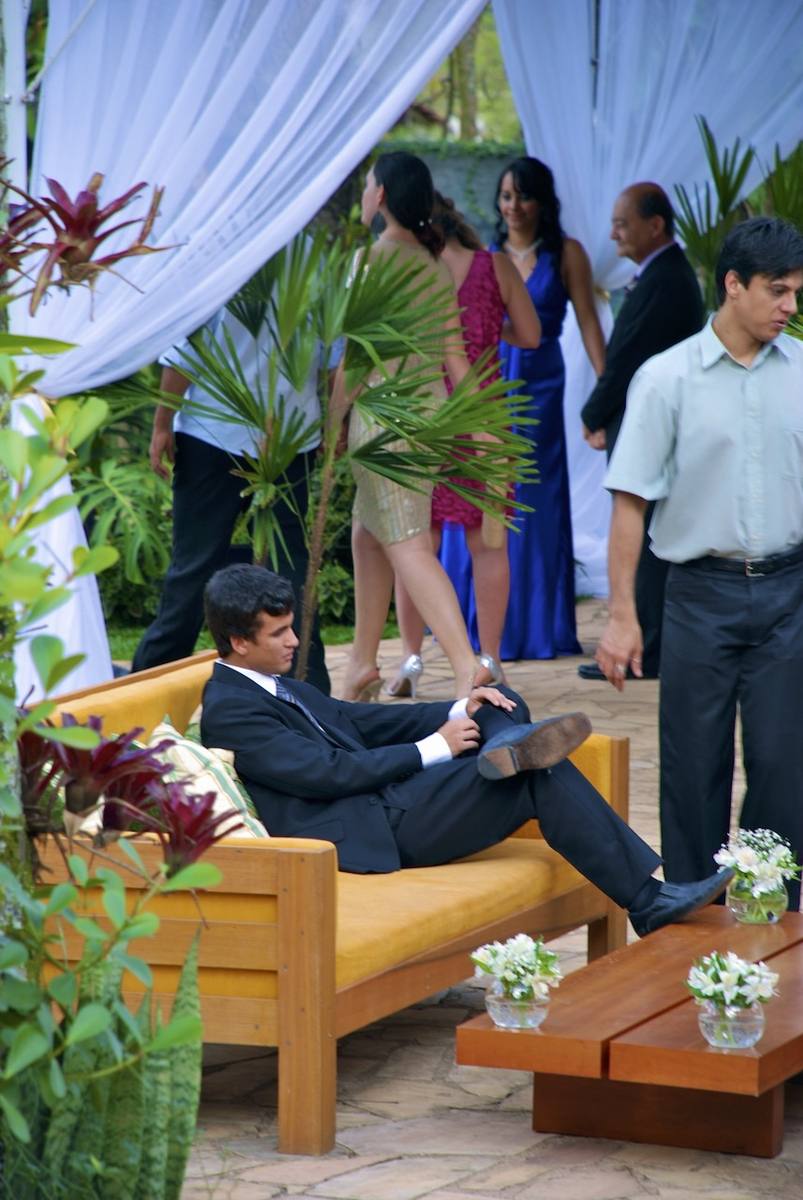 Guests attending ceremony in the garden of Casarão Penedo
